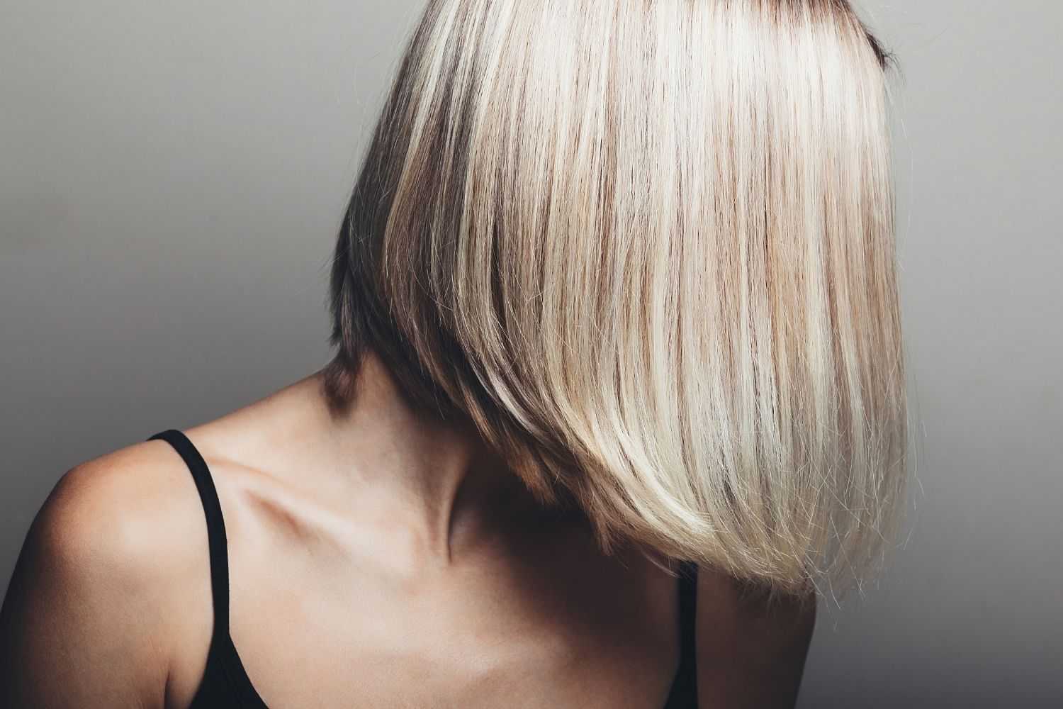 Woman with chic short blonde bob haircut.